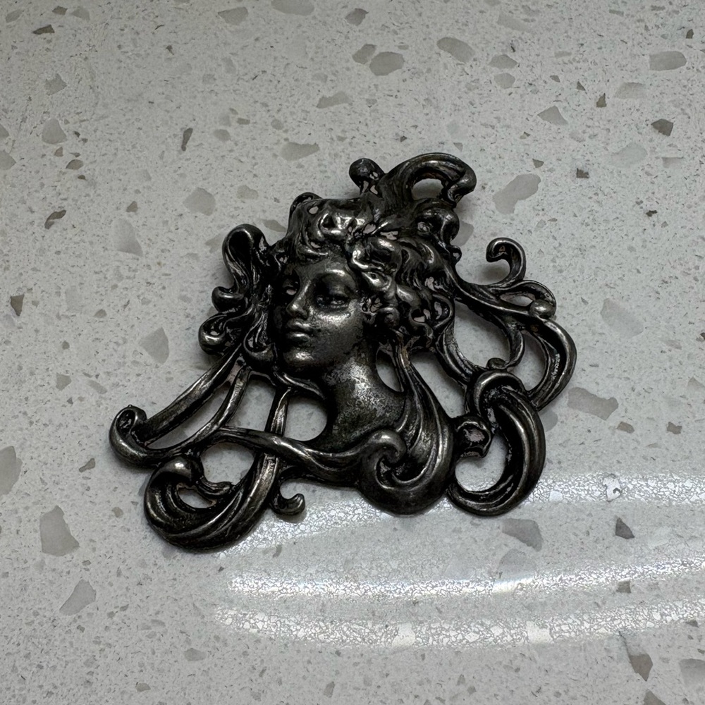 Elegant Art Nouveau Silver Pendant with Intricate Design